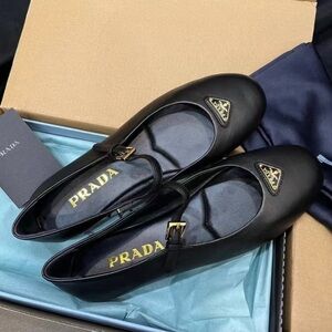 Prada Black Leather Flats with Gold Accents